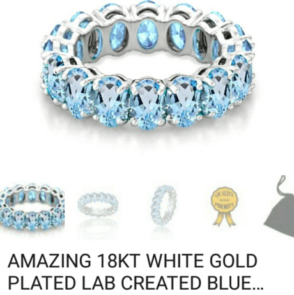 18kt WGP lab Blue Topaz ring in size 8